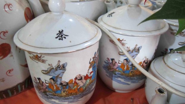 "It was decorated with dozens of porcelain teapots, varying in sizes and shapes, painted with Daoist and Buddhist deities."