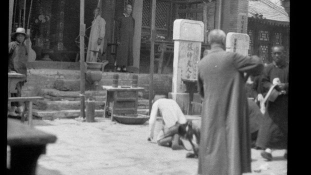 Prostrating before a shrine.